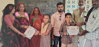 Parmaben knitting a product made by her SHG