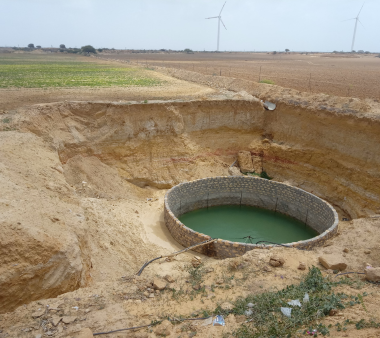 Parmaben knitting a product made by her SHG
